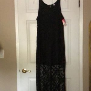 Long black sleeveless maxi dress.